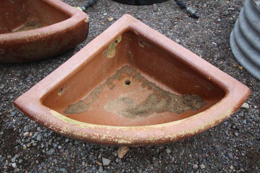 A quarter glazed stoneware horse feed bowl