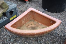 A quarter glazed stoneware horse feed bowl