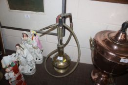 A brass hookah pipe with coloured stone decoration