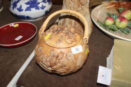 A Bernard Rooke pottery biscuit barrel with raised