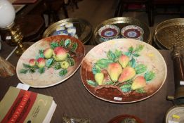 A pair of late 19th / early 20th Century Continental pottery plaques with apple and pear