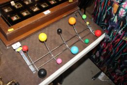 An atomic style coat rack