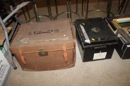 A canvas and leather mounted storage trunk and a m