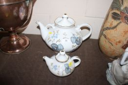 A large continental porcelain tea pot with floral
