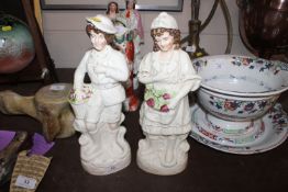 A pair of Staffordshire figures