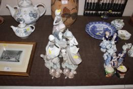 Four Lladro porcelain figure groups and two Lladro