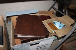 Three boxes of albums and postcards