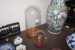 Two glass domes and bases