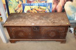 A carved oak coffer