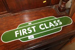 A reproduction 'First Class' advertising sign (210