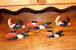Five reproduction coat hooks and plaques