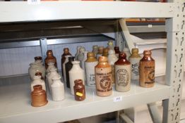 A collection of various stoneware bottles to inclu
