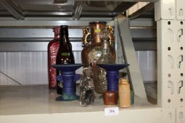 A pair of candlesticks, an ethnic figure, oriental