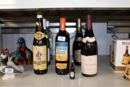 A collection of various alcohol to include Donaine