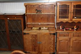A pine dresser raised on cupboard base