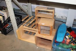 A wooden and metal wine rack and a quantity of woo