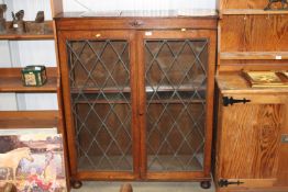 An oak and leaded glazed display bookcase AF