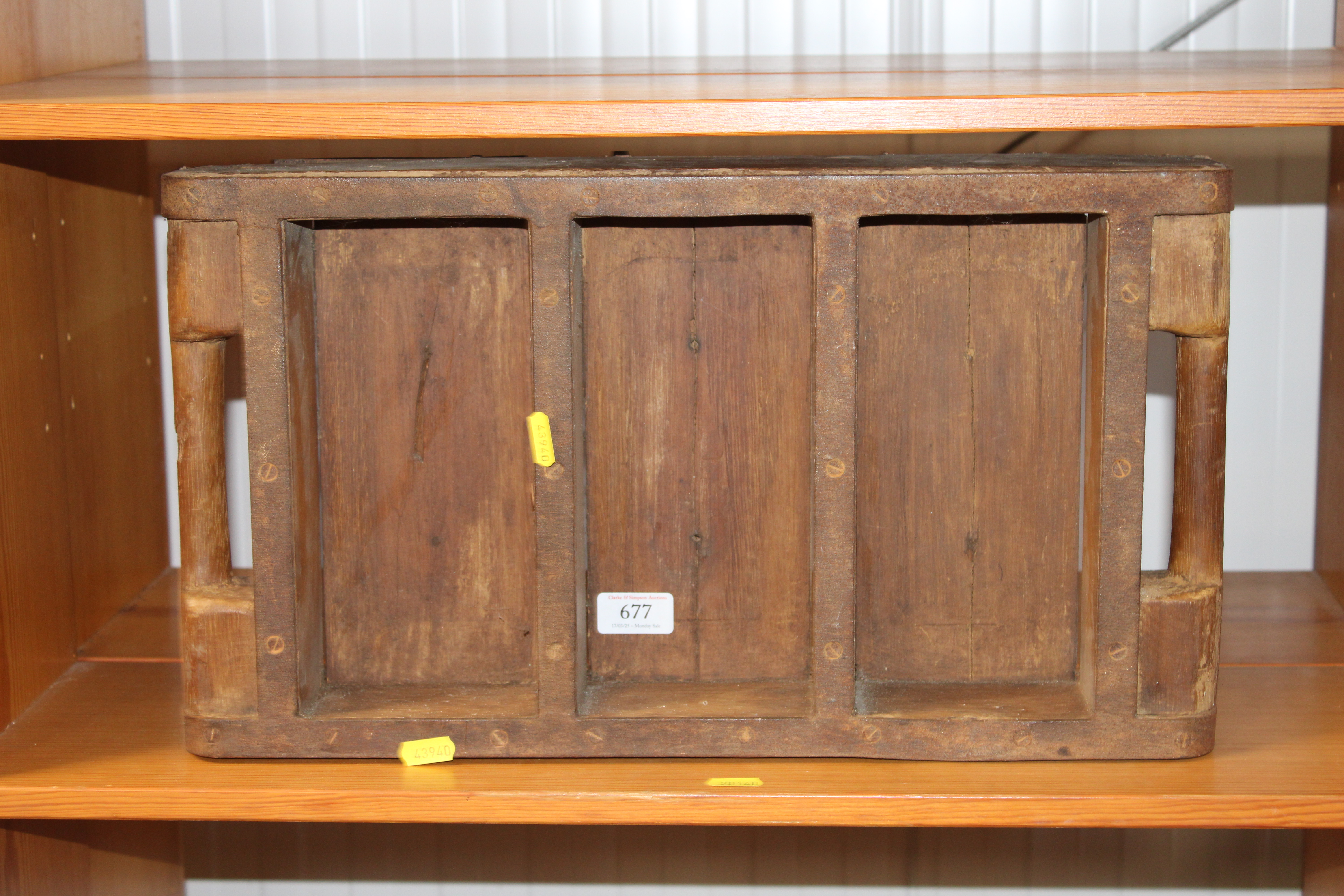 A wooden and metal brick mould