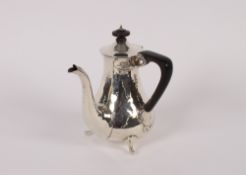 An Edwardian spot hammered silver side pouring chocolate pot, with black wood handle and lift,