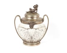 A continental white metal mounted punch set, comprising of a cut glass punch bowl with rams head