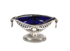 A late Victorian silver oval salt, having and pierced and garland decorated border raised on