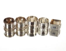 A pair of numbered silver napkin rings, with beaded decoration, London 1889; a square silver