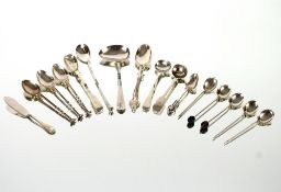 A collection of various silver fancy spoons, condiment spoons, tea spoons, butter knife etc. total
