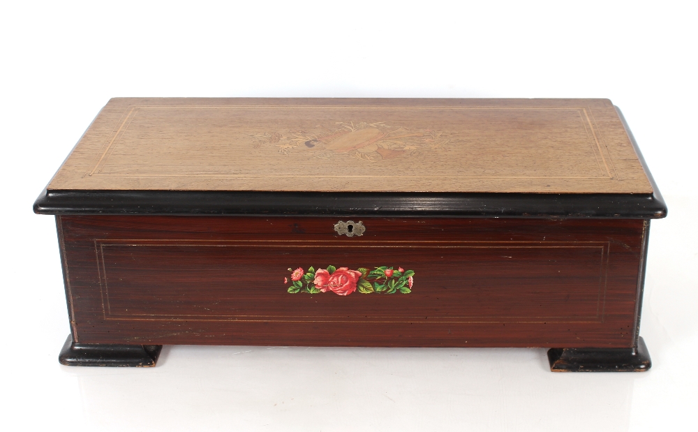 A rosewood cased and inlaid Swiss music box, playing ten airs, 60cm wide x 29cm deep x 19cm high