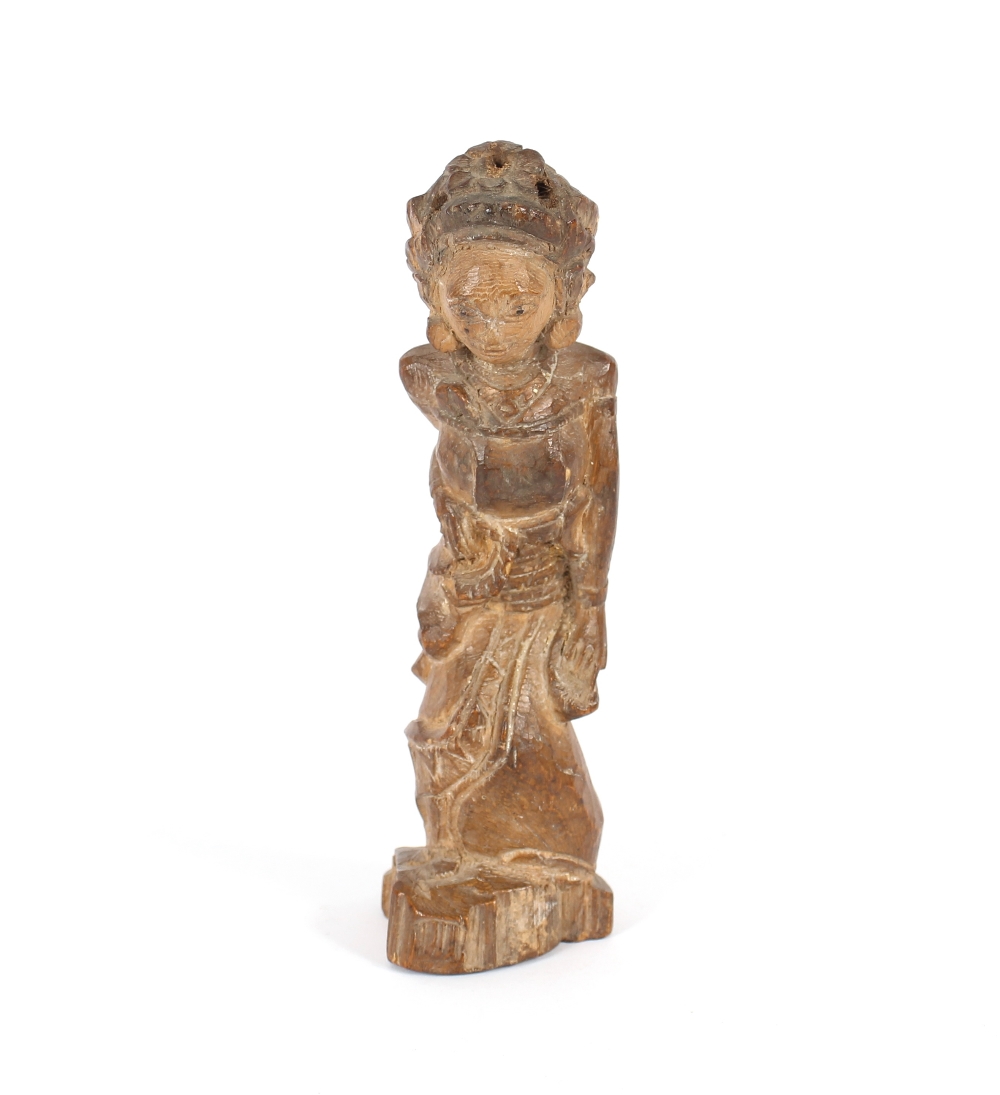 A carved wooden figure of a girl dancer, possibly Balinese, 20cm