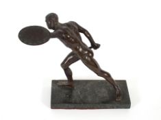 After The Antique, bronze figure of a naked gladiator with sword and shield, raised on a green