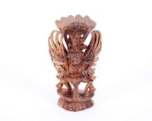 A carved figure of Garuda, possibly Indonesian, 20cm high