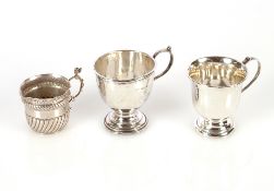 A small silver Christening mug, Birmingham 1930; another similar, Birmingham 1951; and a small