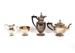 A George V silver octagonal shaped four piece tea set, cream jug and matching sucrier, having gilded