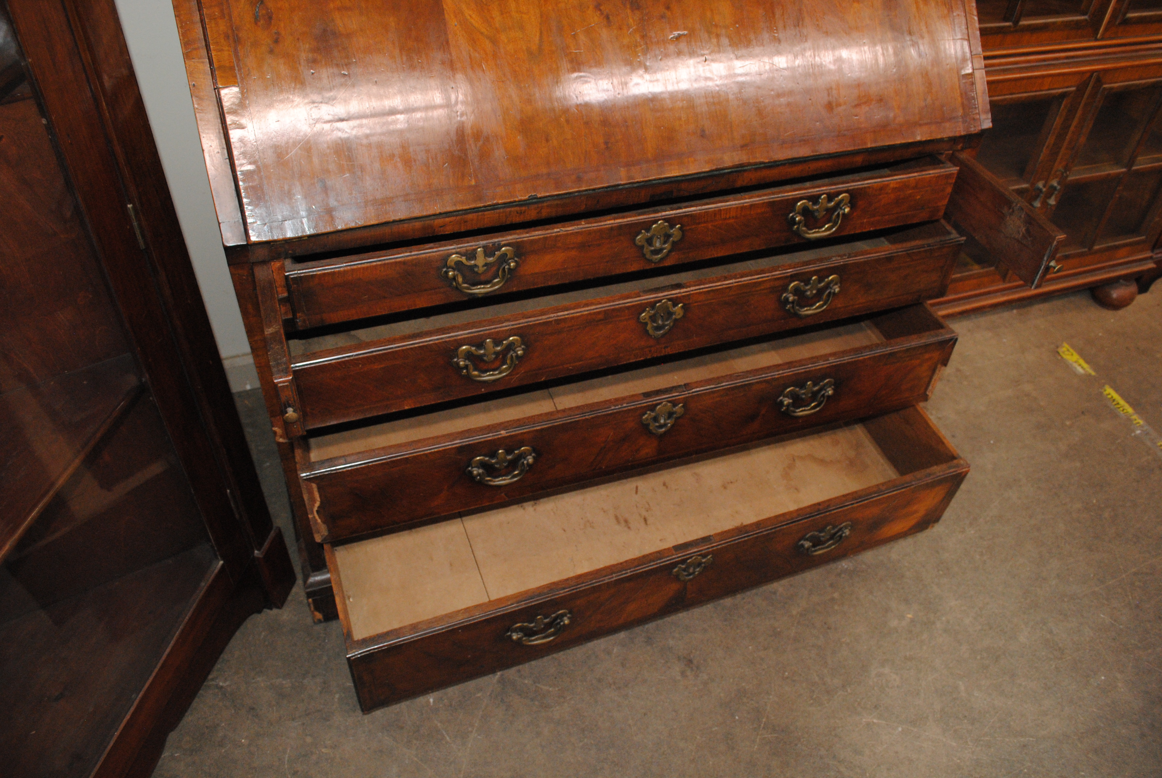 An 18th Century walnut bureau bookcase, the upper section fitted pigeonholes and shelves enclosed by - Image 6 of 7