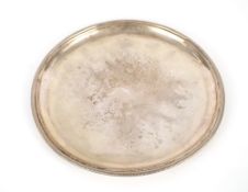 An Italian white metal circular tray, having gadrooned border, stamped 800, R. Miratoli Milano, 29cm