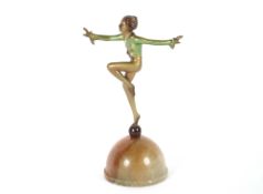 Manner of Josef Lorenzl, cold painted bronze figure of an Art Deco period dancing girl, raised on