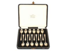 A cased set of twelve silver teaspoons, retailed by William H. May, Clumber Street Nottingham,