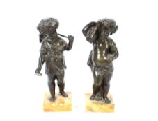 A pair of bronze harvesting cherubs, raised on marble plinths, 22cm high