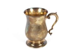 A cased silver tankard of baluster form, having presentation inscription 'Bass Gold Cup',