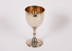 A George V silver goblet, having waisted stem and circular spread foot, 19cm high, 174.8gms