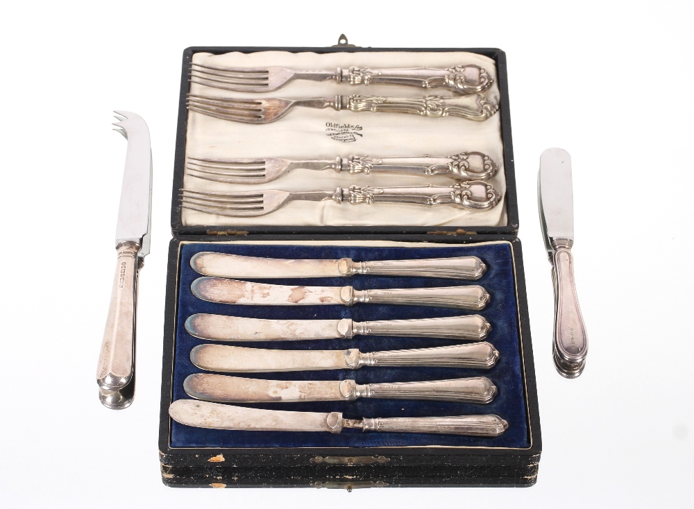A cased set of six silver handled tea knives; a silver handled cheese knife; a butter knife; four