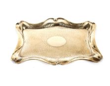 A silver dressing table tray, of shaped rectangular form having spot hammered decoration and