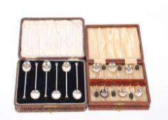 A cased set of silver seal end coffee spoons, Birmingham 1924; and a cased set of six bean end