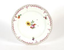 A pair of KPM cabinet plates, having foliate decoration within shaped link pattern borders, 24.5cm