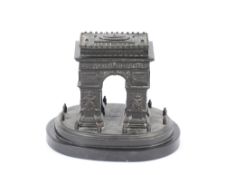 A bronze study of The Arc de Triomphe, on oval black onyx base, 18cm high x 20cm long overall