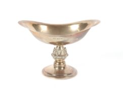 A 20th Century silver pedestal bon bon dish, having stylised embossed baluster stem and spread foot,