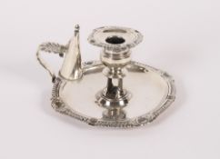 A George III silver chamber stick, having gadrooned and shell decorated border, Birmingham 1814,