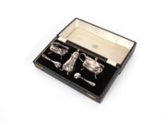 A cased silver three piece cruet, by Adie Bros., Birmingham 1958, having odd silver and plated