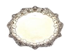 A late Victorian silver salver, having shell and foliate cast border, Sheffield 1900, 30cm dia.