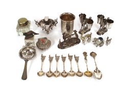 A white metal thimble shaped measure, stamped to base W.B.800; a pair of Continental white metal